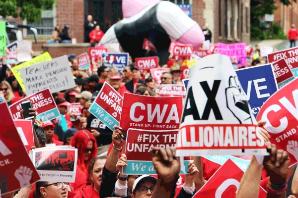CWA rally with red signs 