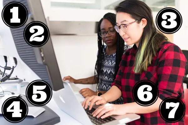two women working at a computer
