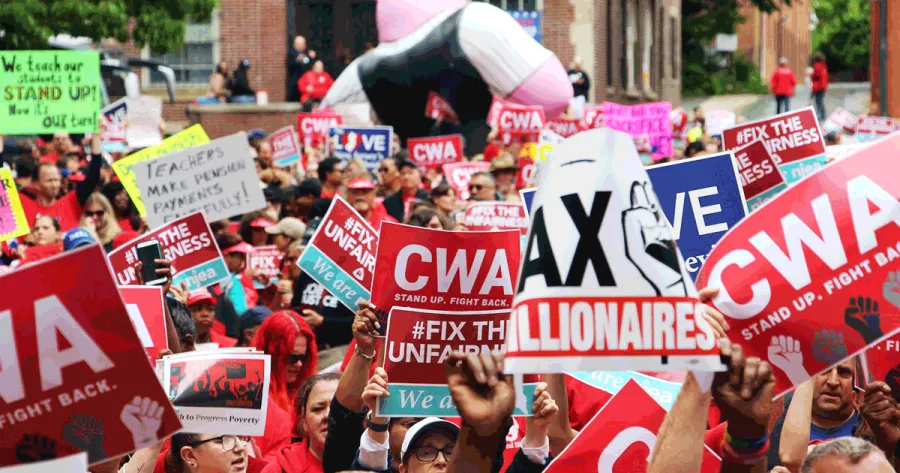 CWA rally with red signs 
