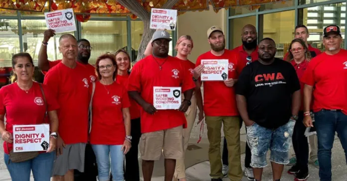 CWA Local 3179 members and allies pose for pictures